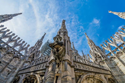 Low angle view of statue against cloudy sky
