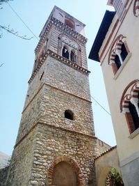 Low angle view of bell tower against sky