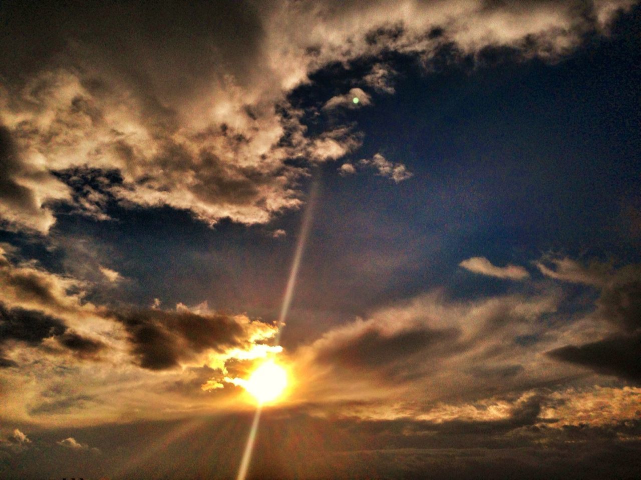 sun, low angle view, sky, cloud - sky, sunbeam, sunset, sunlight, cloudy, silhouette, lens flare, cloud, nature, beauty in nature, tranquility, scenics, back lit, bright, tranquil scene, no people, outdoors