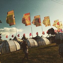 Low angle view of people against sky