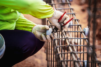 Close-up of hand holding metal