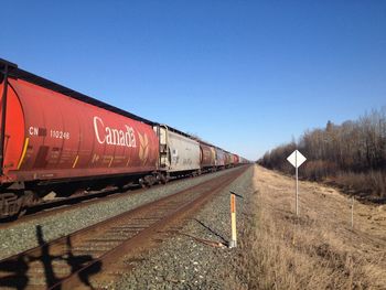 Railroad track against clear sky