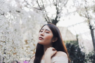 Portrait of young woman looking away