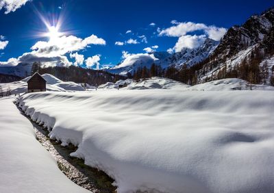 Scenic view of snowcapped mountains against sky