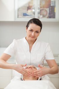 Woman getting beauty treatment from doctor