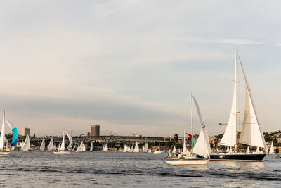 Boats in sea against sky