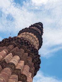 Low angle view of historical building against cloudy sky