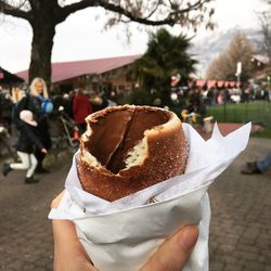 Close-up of hand holding ice cream