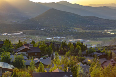 High angle view of townscape and mountains against sky