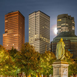 Low angle view of illuminated buildings against sky