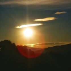 Scenic view of silhouette mountains against sky during sunset