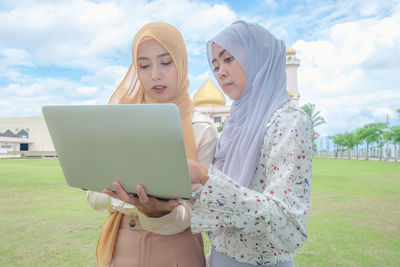 Young woman using mobile phone