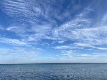 Scenic view of sea against blue sky