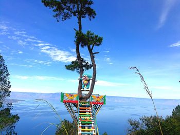 Ferris wheel against blue sky