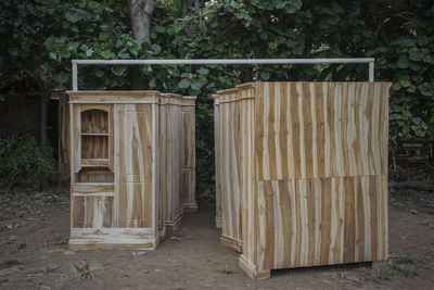 Closed wooden cupboard on field