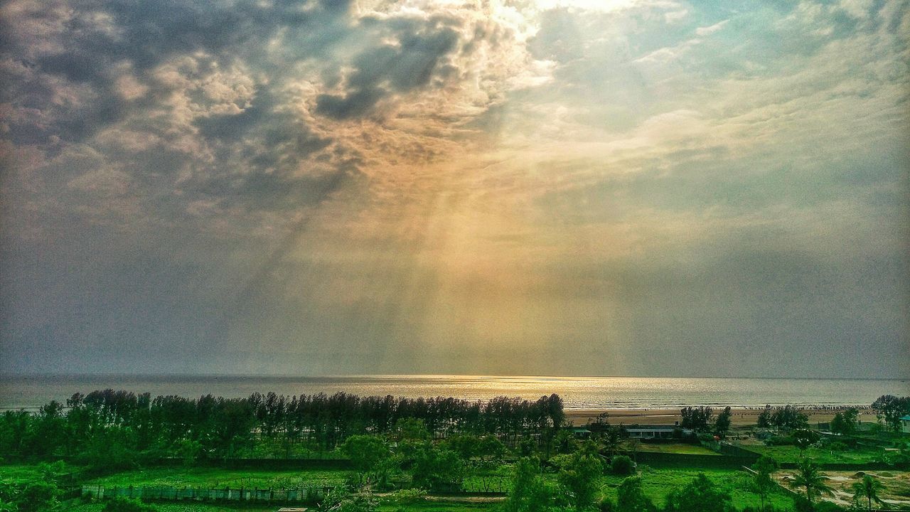 sky, cloud - sky, beauty in nature, scenics, nature, tranquil scene, tranquility, field, no people, outdoors, landscape, agriculture, day, growth, water, rural scene, tree, horizon over water, grass, building exterior, architecture