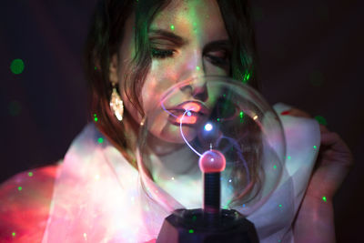 Woman kissing crystal ball