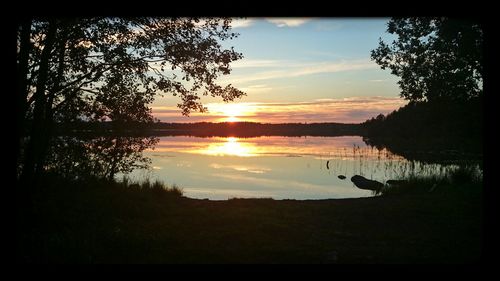 Scenic view of calm sea at sunset