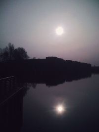 Scenic view of lake at sunset