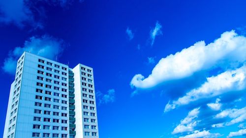 Low angle view of building against cloudy sky