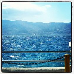 Scenic view of sea against cloudy sky