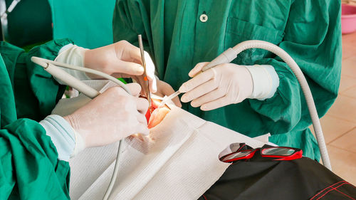 Close-up of hands on doing surgery