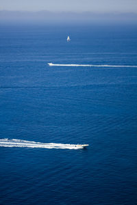 Boat sailing in sea against sky