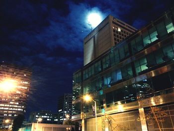 Low angle view of illuminated city at night