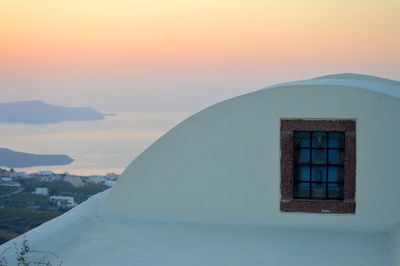 House against sky during sunset