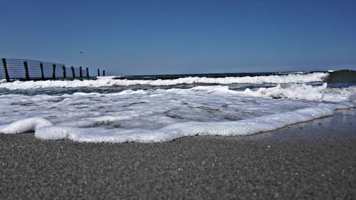 Scenic view of sea against clear sky
