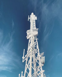 Low angle view of communications tower against sky