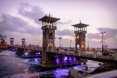 View of bridge and buildings against sky