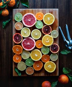Directly above shot of various citrus fruits on cutting board