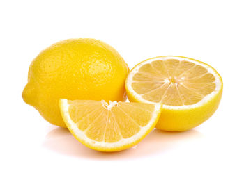 Close-up of oranges against white background