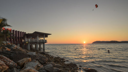 Scenic view of calm sea at sunset