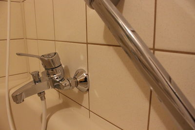 Close-up of faucet in bathroom