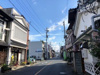 Street amidst buildings against sky