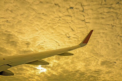 Close-up of airplane flying in sky