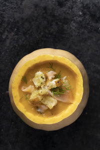 High angle view of lemon in plate on table