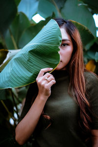 Portrait of beautiful young woman outdoors