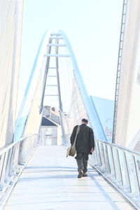 Full length of a man walking on elevated road