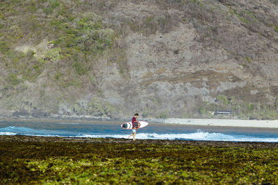 Young man at the beach, sumbawa,indonesia