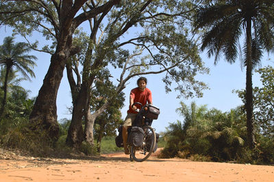 Man riding motorcycle sitting on road