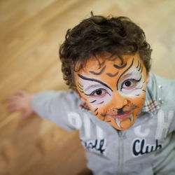 High angle portrait of happy boy with face paint