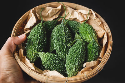 Close-up of hand holding strawberries