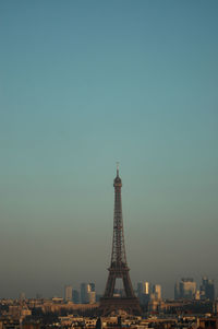 Eiffel tower against clear sky during sunset