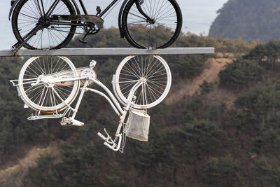 View of bicycle art craft hanging in the air