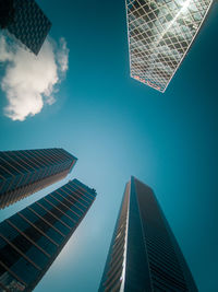 Low angle view of modern buildings against sky