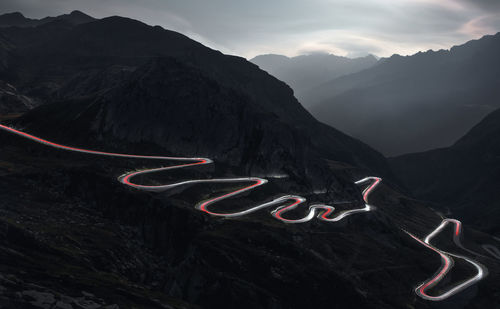 Aerial view of light trails on mountain road