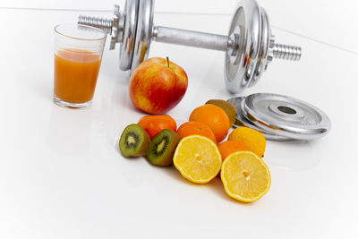 Fruits in glass on table